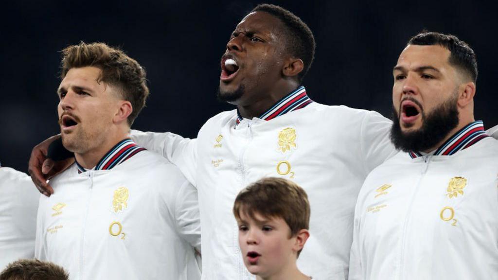 Henry Slade (left), Maro Itoje (centre) and Ellis Genge (right) of England sing the national anthem before a game against South Africa in November