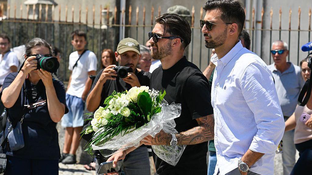 Nottingham Forest and Portugal midfielder Jota Silva holding a wreath outside the Chapel of Resurrection in Gondomar