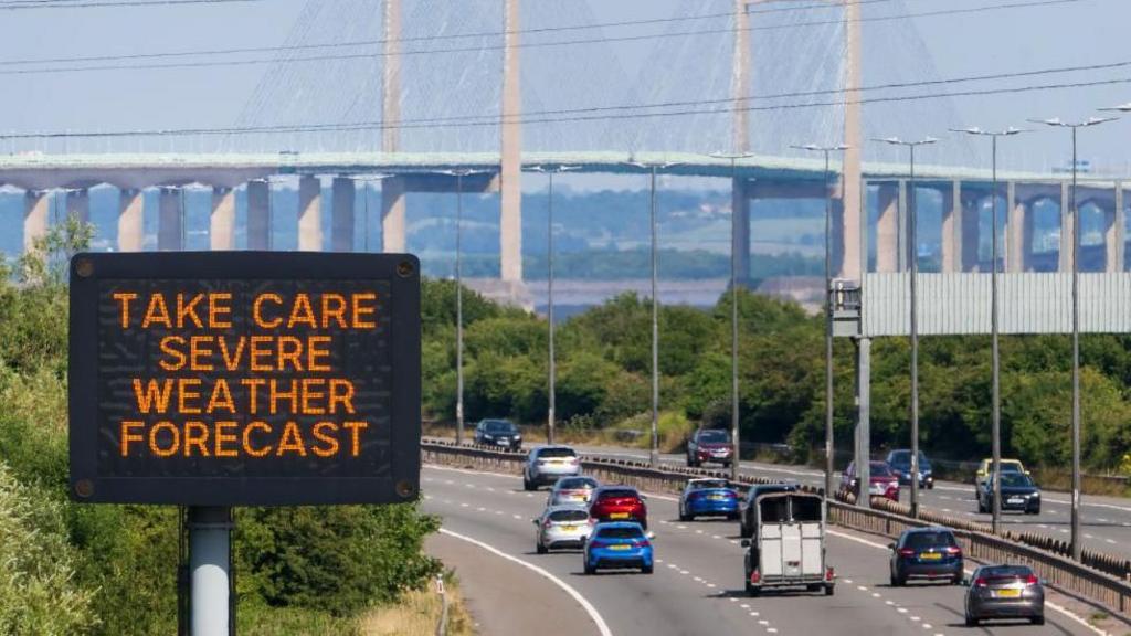 A sign on the M4 near the Prince of Wales Bridge warns motorists to take care due to the severe weather forecast on July 16, 2022.