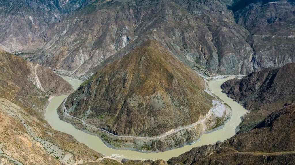 A spectacular bend in the Jinsha river as it winds all the way around mountain, is seen in an aerial photo of Garze city, Sichuan Province.