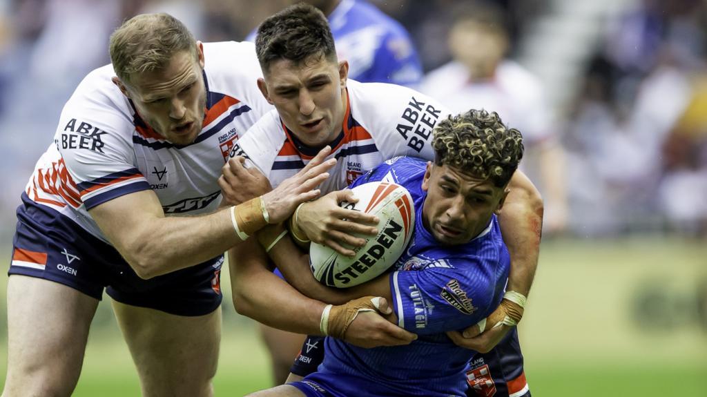 Victor Radley and Tom Burgess tackle