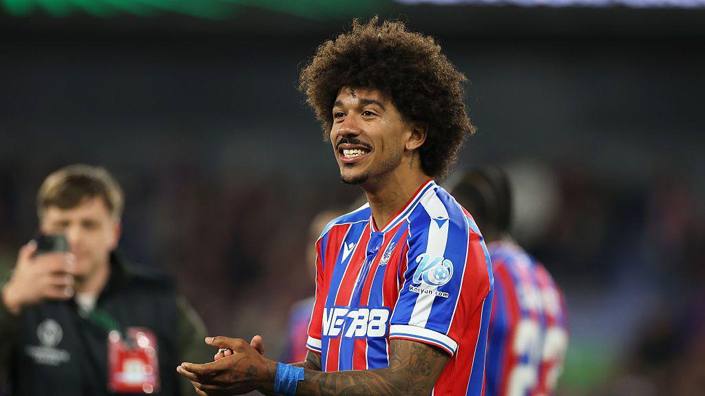 Chris Richards clapping his hands together after a Conference League win over Shakhtar in the semi-final