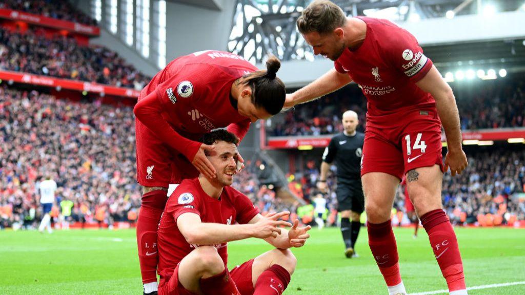 Diogo Jota of Liverpool celebrates with team-mates Darwin Nunez and Jordan Henderson after scoring the team's fourth goal against Tottenham in April 2023