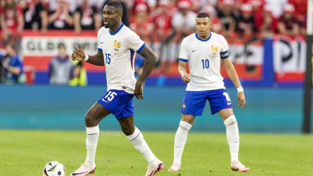 France's Marcus Thuram and Kylian Mbappe in action