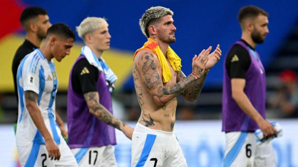 Argentina players walking off after defeat by Colombia