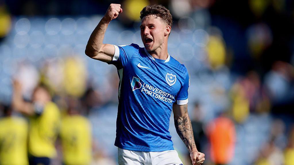 Adrian Segecic celebrates after the game with the Portsmouth supporters 