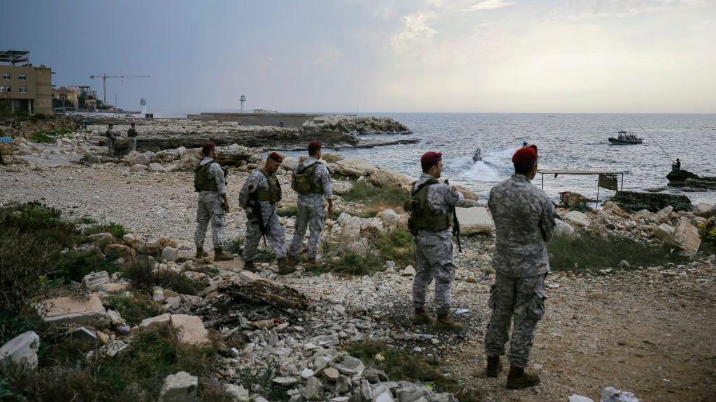 Soldiers from the Lebanese army survey beach 