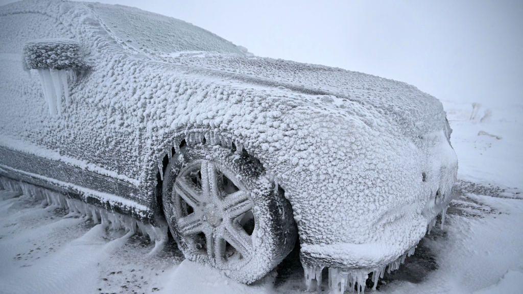 car covered in snow and icicles