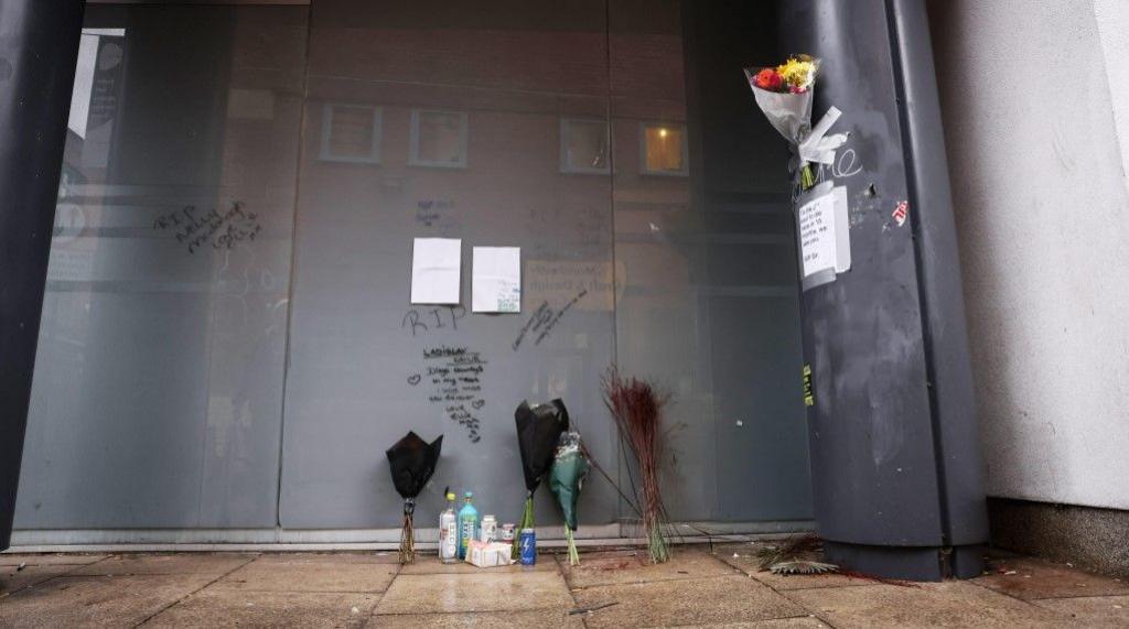 Floral tributes laid in a Manchester doorway and RIP messages scrawled on the wall where Vladislav Kavur, known to his friends as Diego, was found after taking a fatal overdose 