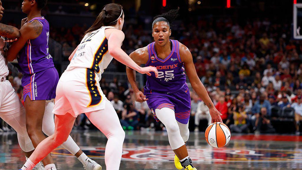 Phoenix Mercury forward Alyssa Thomas drives towards the basket while defended by Indiana Fever guard Caitlin Clark