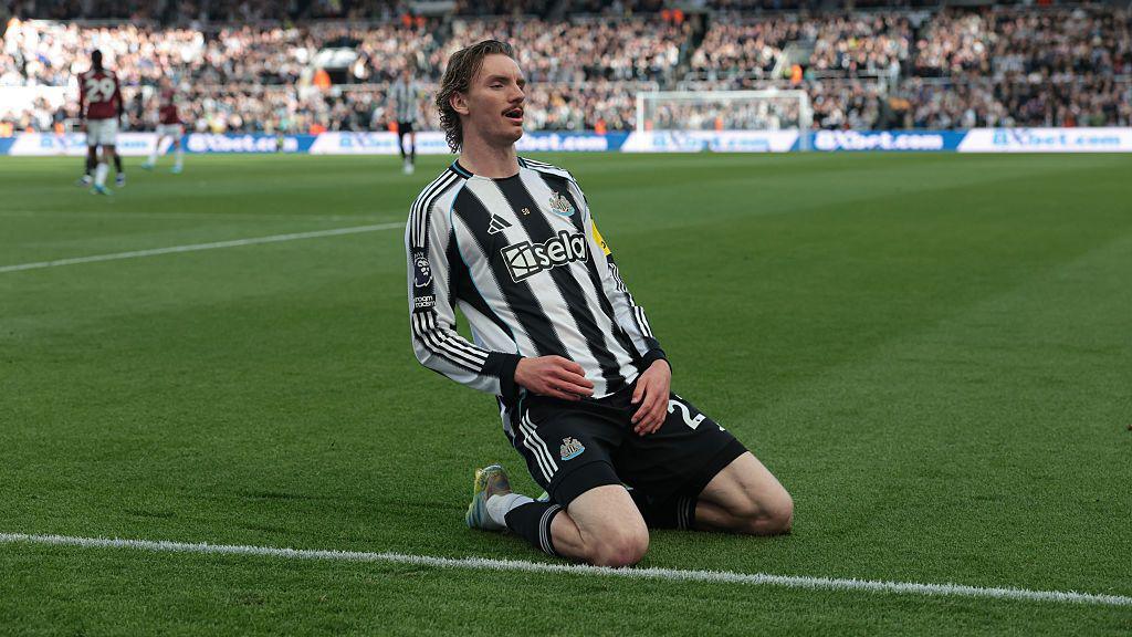 Newcastle's Nick Woltemade slides on his knees in celebration