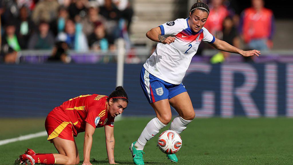 Lucy Bronze of England breaks away from Mariona Caldentey of Spain during the UEFA Women's EURO 2025 Final match