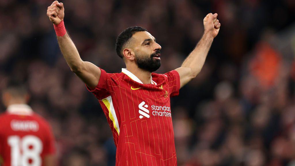 mo salah celebrates with arms outstretched