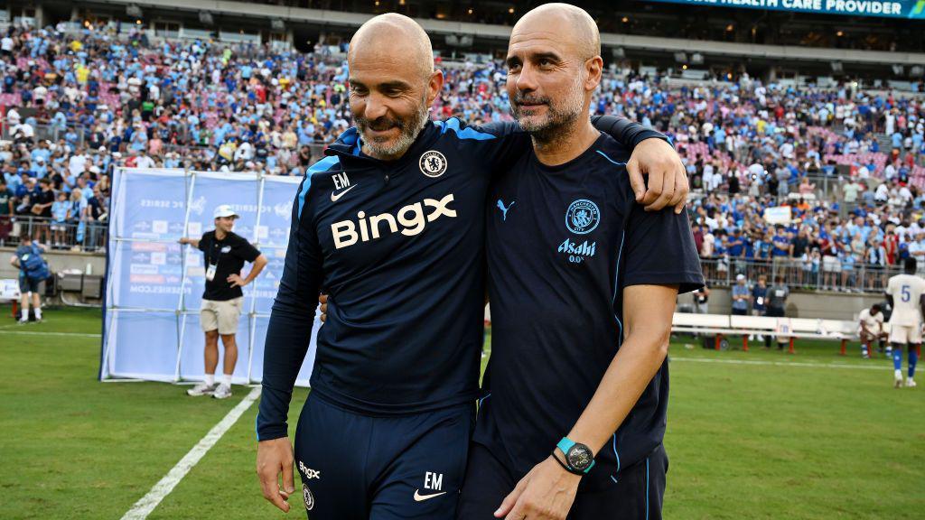 Enzo Maresca, Manager of Chelsea talks to Pep Guardiola, Manager of Manchester City.