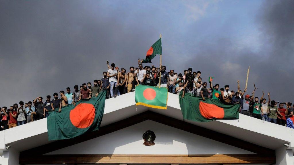 Protesters storming Prime Minister Sheikh Hasina's palace after she fled the country