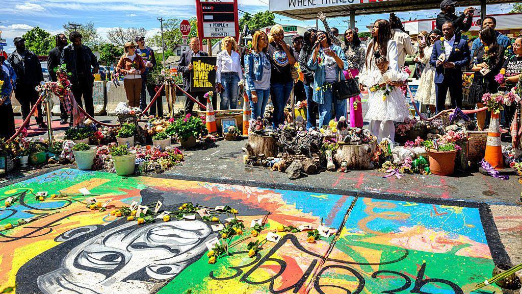 Community members gather to mourn George Floyd