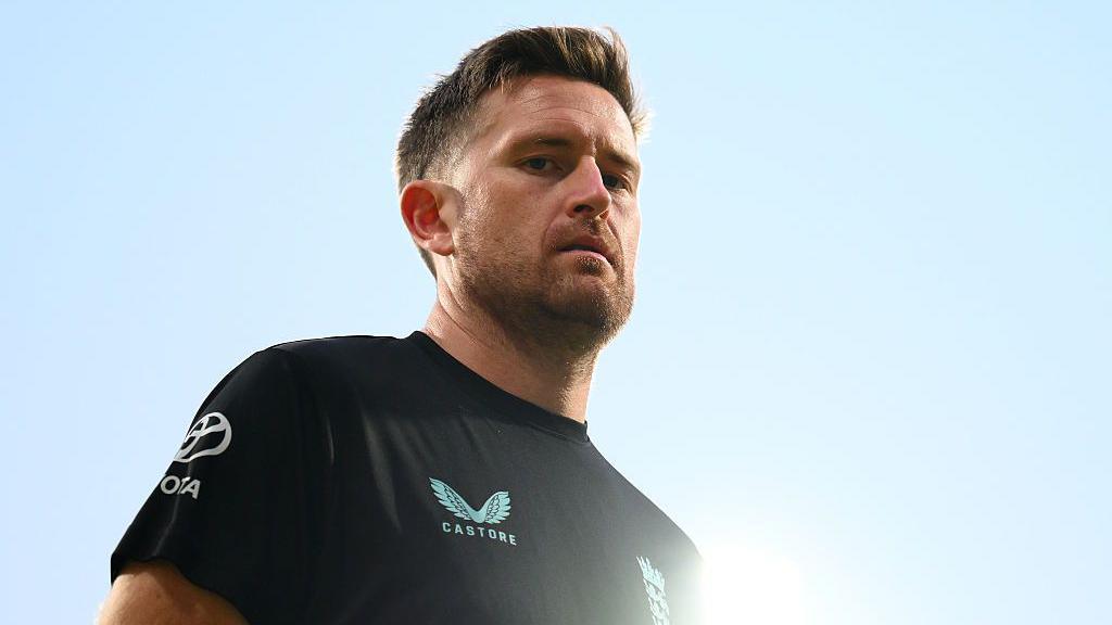 Liam Dawson looks on from the England training camp