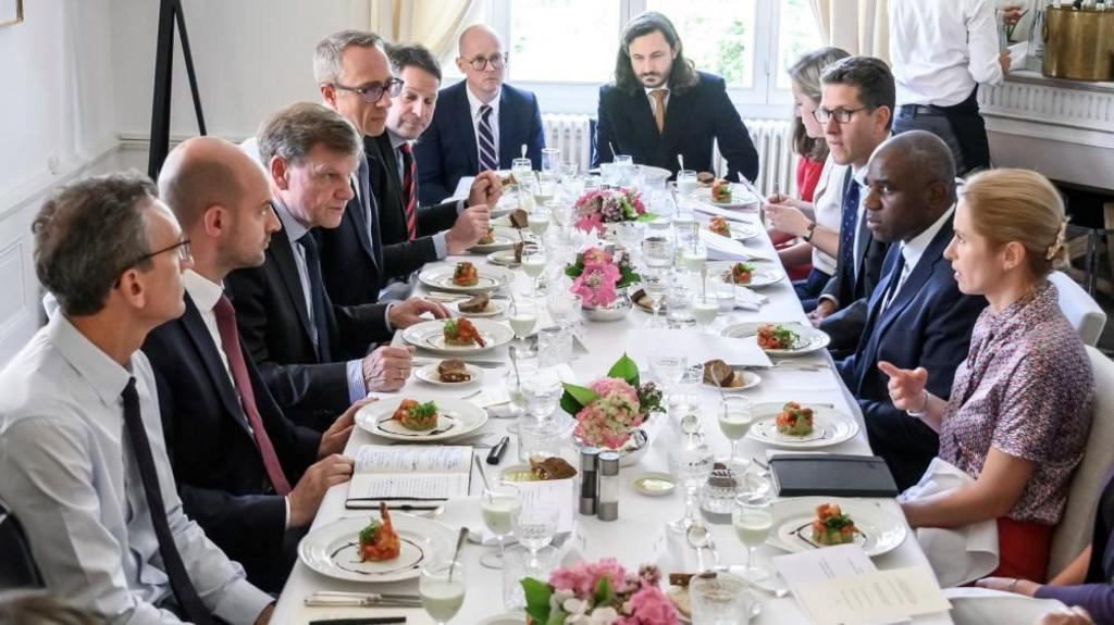 European foreign ministers  talk over lunch at the offices of the honorary Consul of the Federal Republic of Germany in Geneva