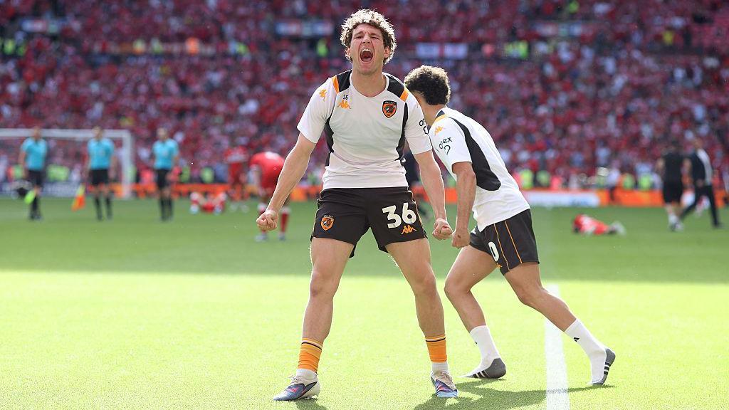 Lewis Koumas of Hull City celebrates their promotion to the Premier League.