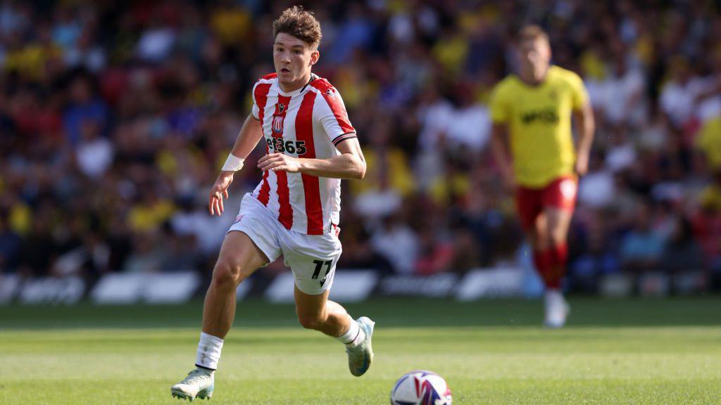 Lewis Koumas running towards the ball while playing for Stoke