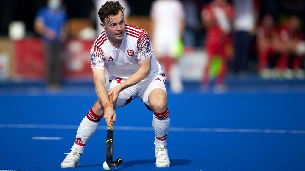 James Albery in action on the hockey pitch for England 