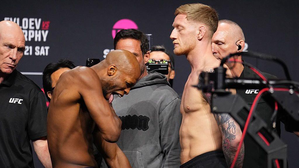Michael Page sticks his tongue out as he faces off with Sam Patterson