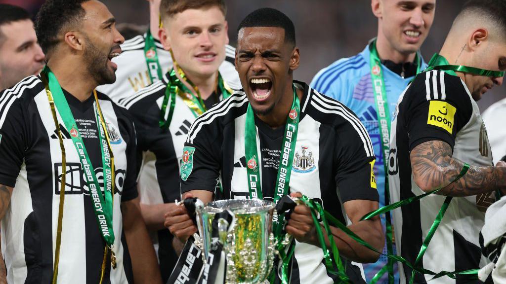 Isak with the Carabao Cup trophy earlier this year.