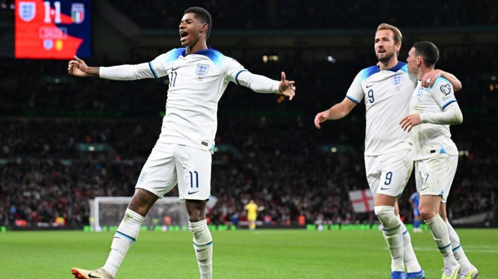 Rashford celebrates with his England team mates