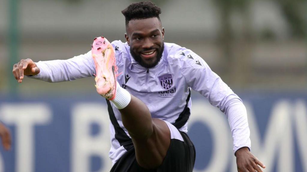 West Bromwich Albion striker Daryl Dike warms up during a training session.