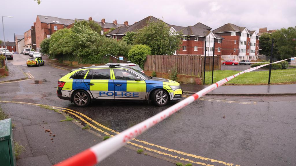 A police cordon at the scene of a stabbing outside apartments in the Kinnaird Avenue area of north Belfast.