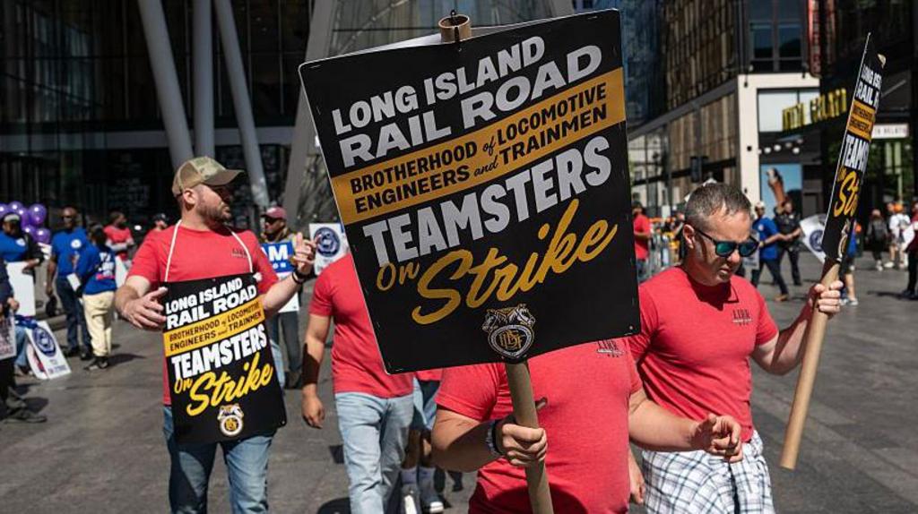Striking rail workers picketing outside New York's Penn Station