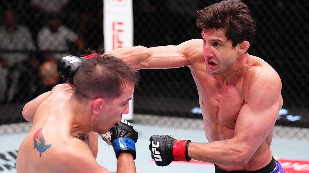 Allan Nascimento punches Cody Durden during a UFC fight