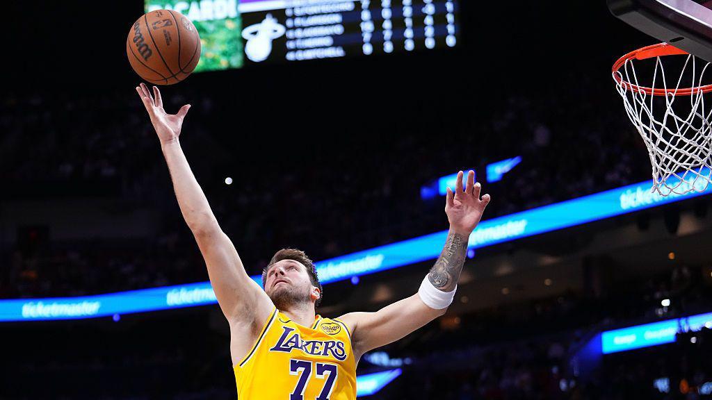 Luka Doncic, Los Angeles Lakers player, collects a rebound against the Miami Heat
