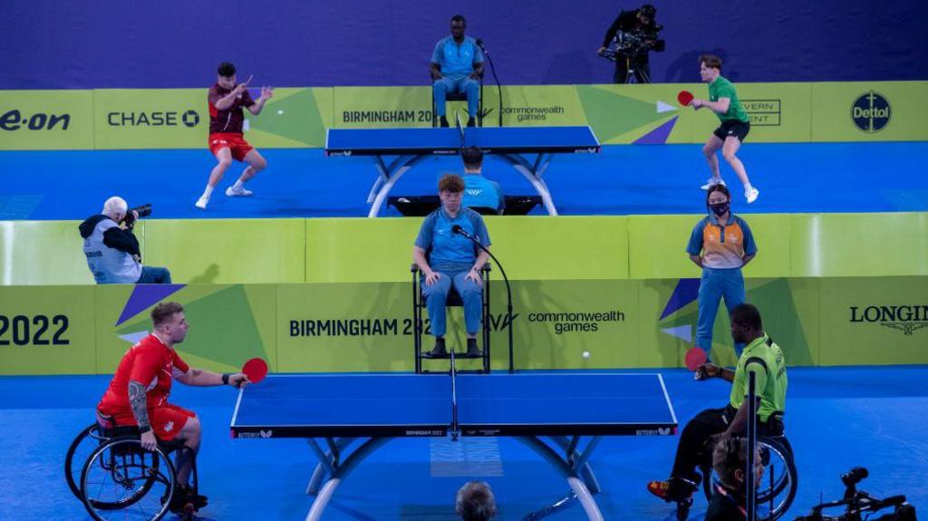 Two para athletes playing table-tennis at the 2022 Commonwealth Games in Birmingham.