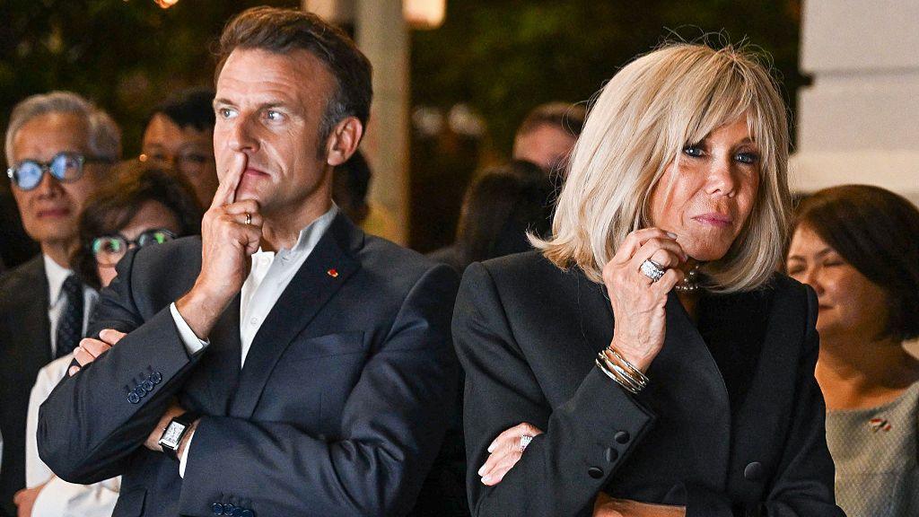 France's President Emmanuel Macron and his wife Brigitte Macron tour the "Two Rivers" exhibition held on Anderson Bridge in Singapore on 29 May 2025.
