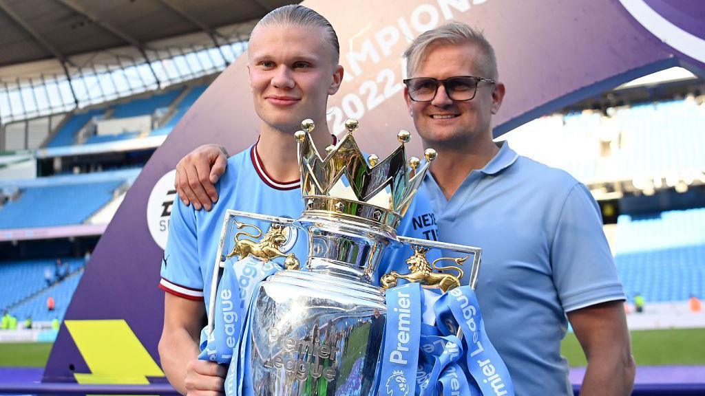 Erling and Alf-Inge Haaland with the Premier League trophy