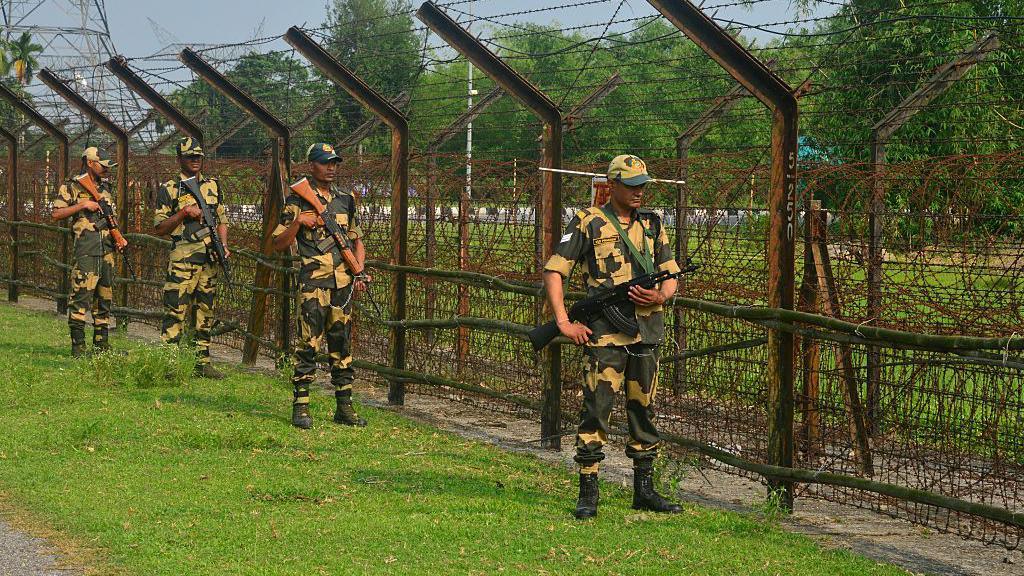 Indian Border Security Force (BSF) personnel stand guard at the India-Bangladesh border in Fulbari BOP (Border outpost) on the outskirts of Siliguri, India on May 9, 2025. 