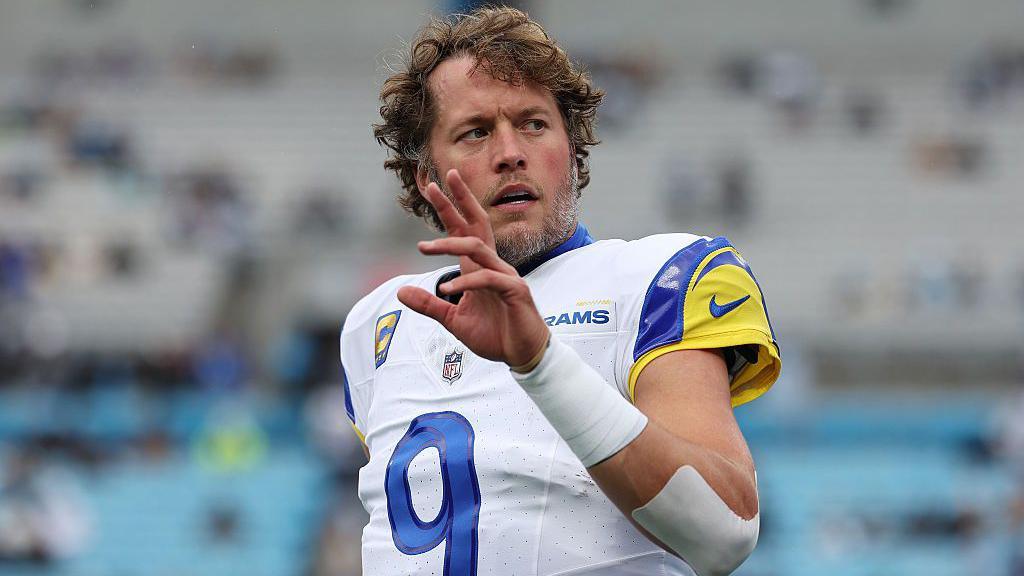 Matthew Stafford of the Los Angeles Rams holds his hand up during an NFL game against the Carolina Panthers