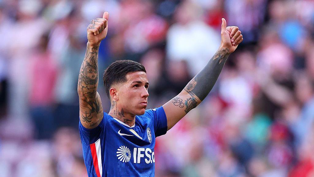Enzo Fernandez of Chelsea gives a thumbs up to the fans