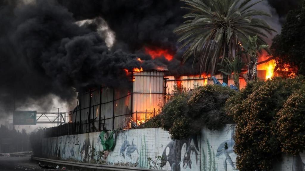 Fire ignited at the impact site following an Iranian missile strike, amid the U.S.-Israeli conflict with Iran, in central Israel March 13, 2026.