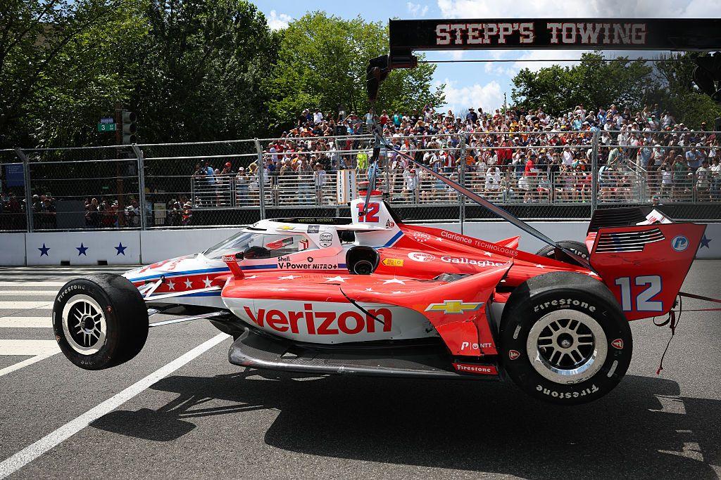 The #12 Verizon Team Penske Chevrolet of David Malukas is carried out after a crash in the NTT INDYCAR Series on August 23, 2026 in Washington, DC.