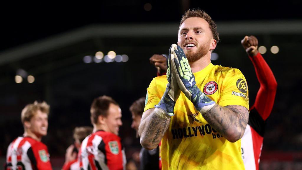 Mark Flekken acknowledges fans after penalty shoot-out win 