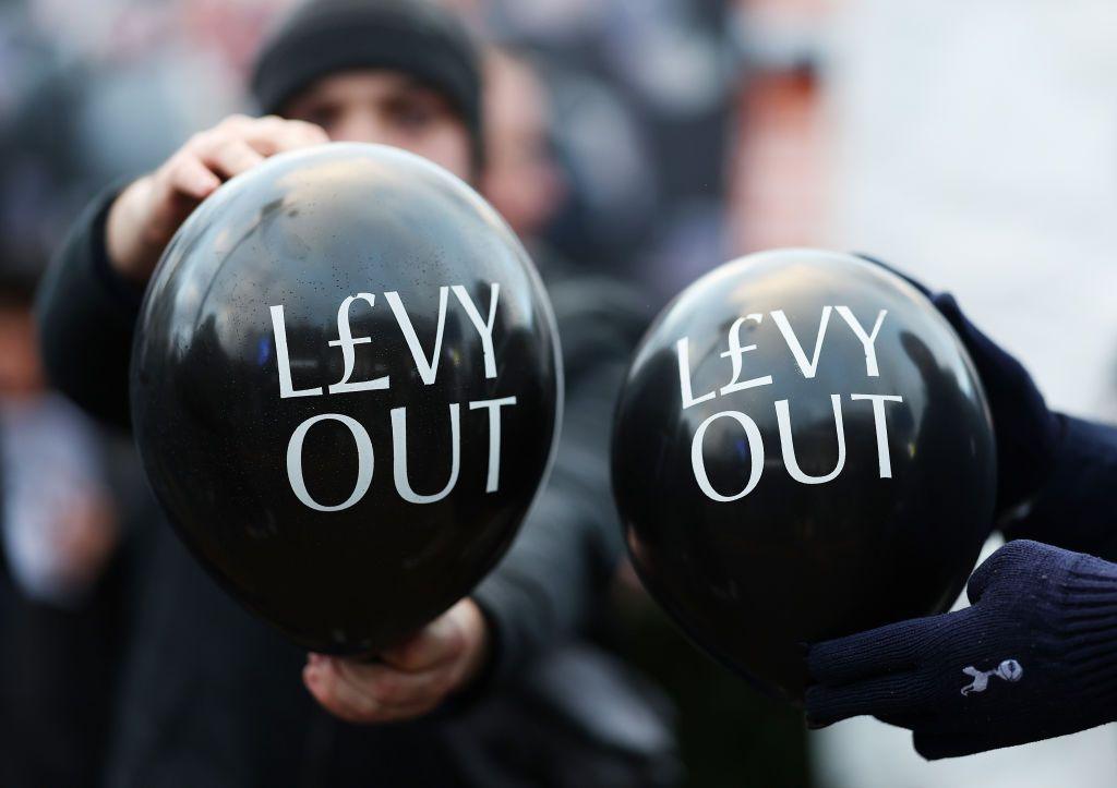 A group of Tottenham fans protesting against chairman Daniel Levy in December 2024