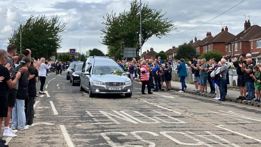 Funeral cortege passes in Castleford