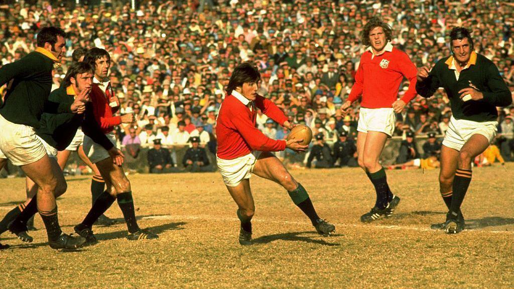Andy Irvine running with the ball for the British and Irish Lions