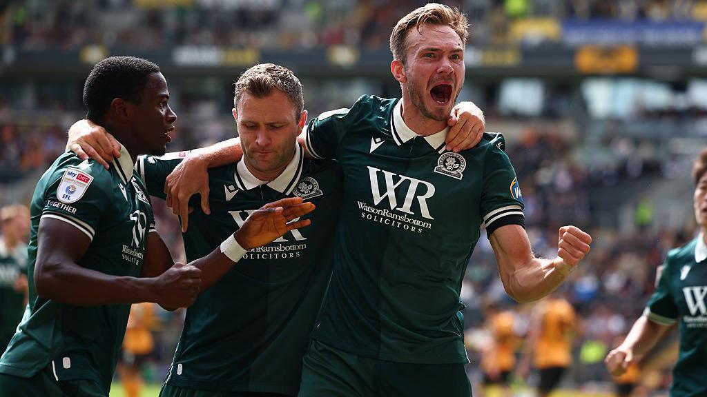 Blackburn Rovers' players celebrate scoring against Hull.