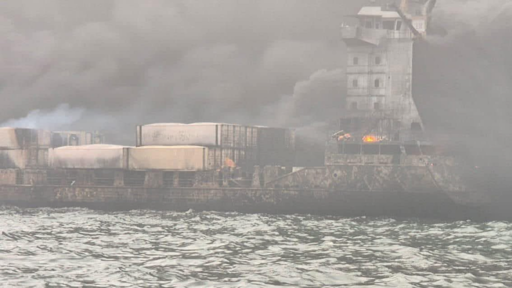 A close up image of the ship shows it on fire