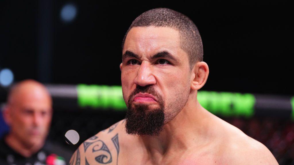 Robert Whittaker in action against Khamzat Chimaev in October