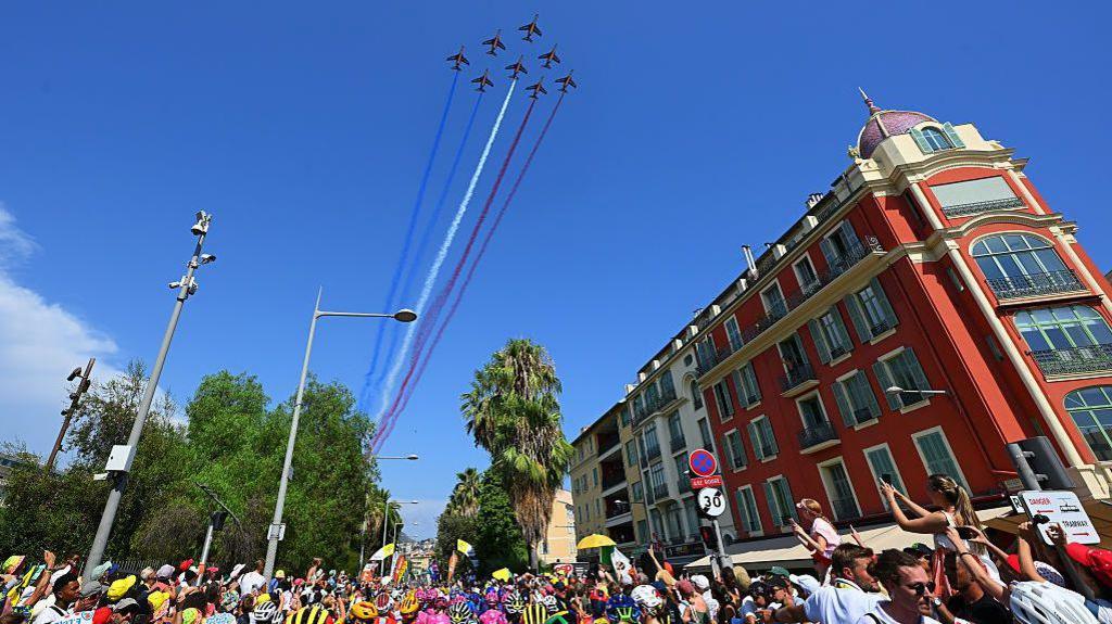 The Patrouille de France flies over the peloton prior to the final stage of the 2026 Tour de France Femmes