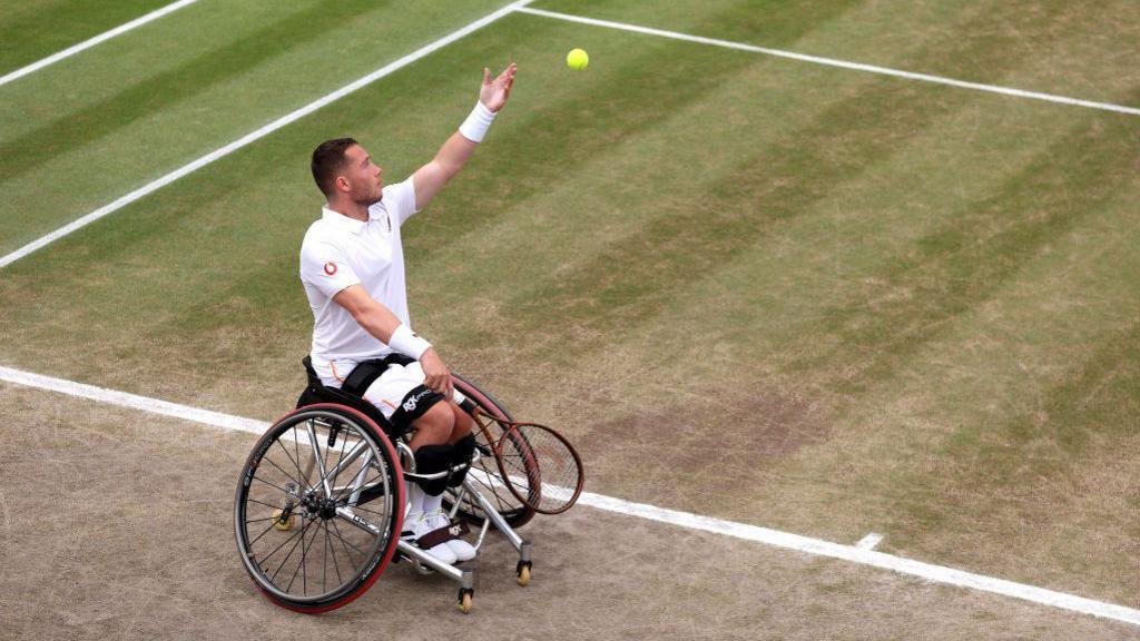 Alfie Hewett serving at Wimbledon